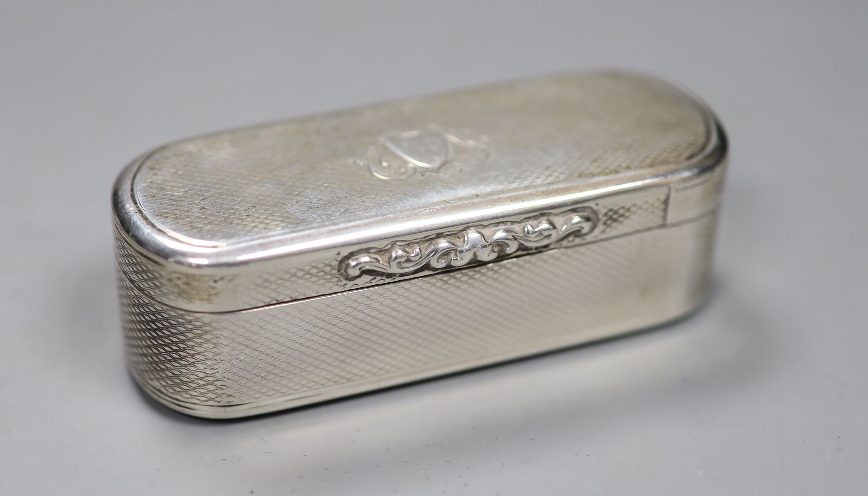 A Victorian engine turned silver oval snuff box, Edward Smith, Birmingham, 1856, 92mm, 113 grams.